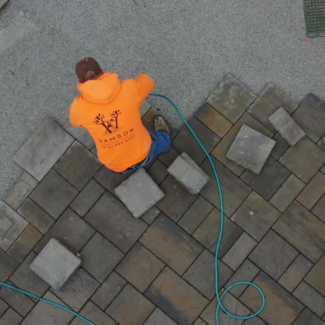 Setting the last pavers into a finished field, seen from overhead