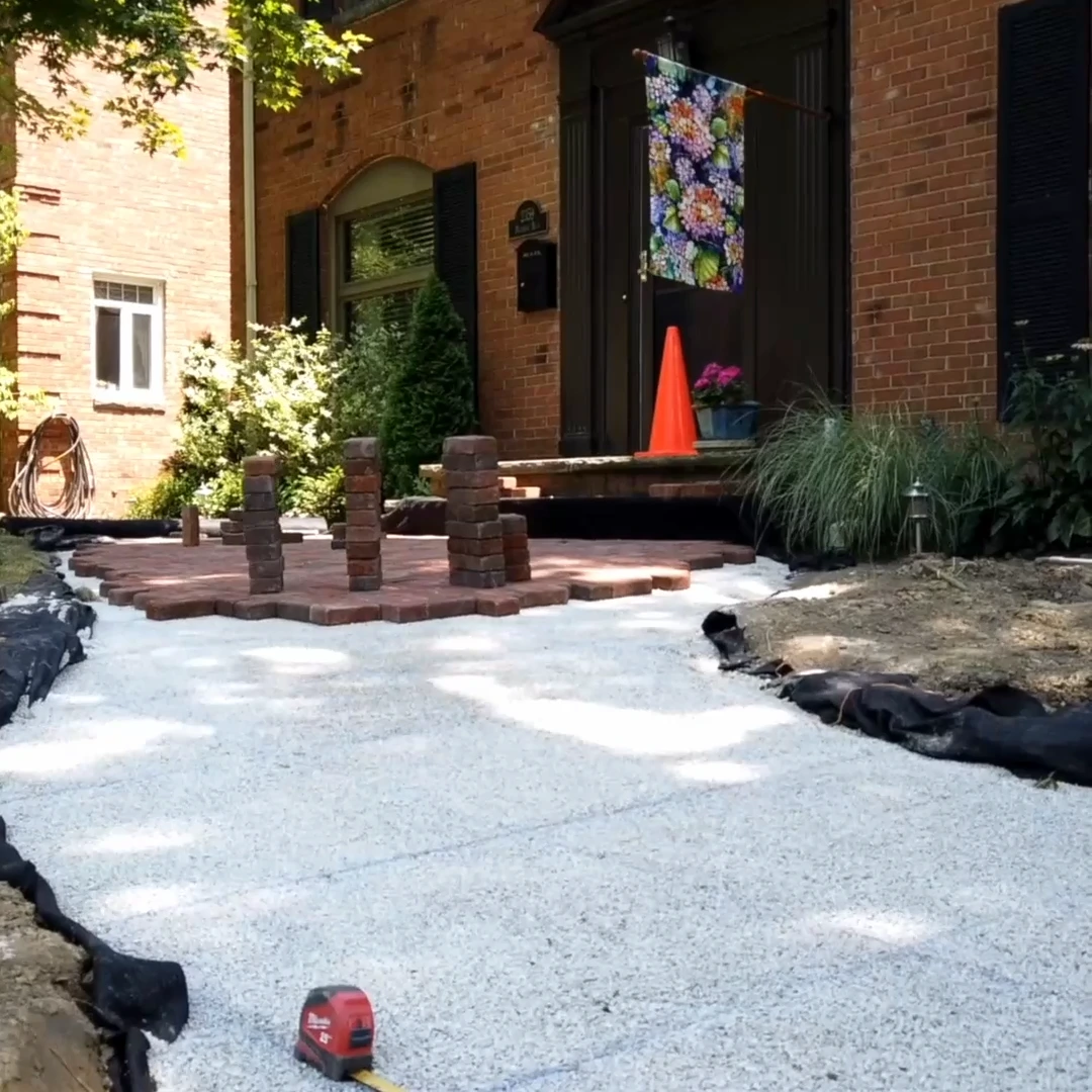 Brick paver walkway going in over a compacted stone base